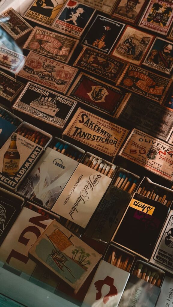 Close-up of a diverse vintage matchbox collection, showcasing retro designs.